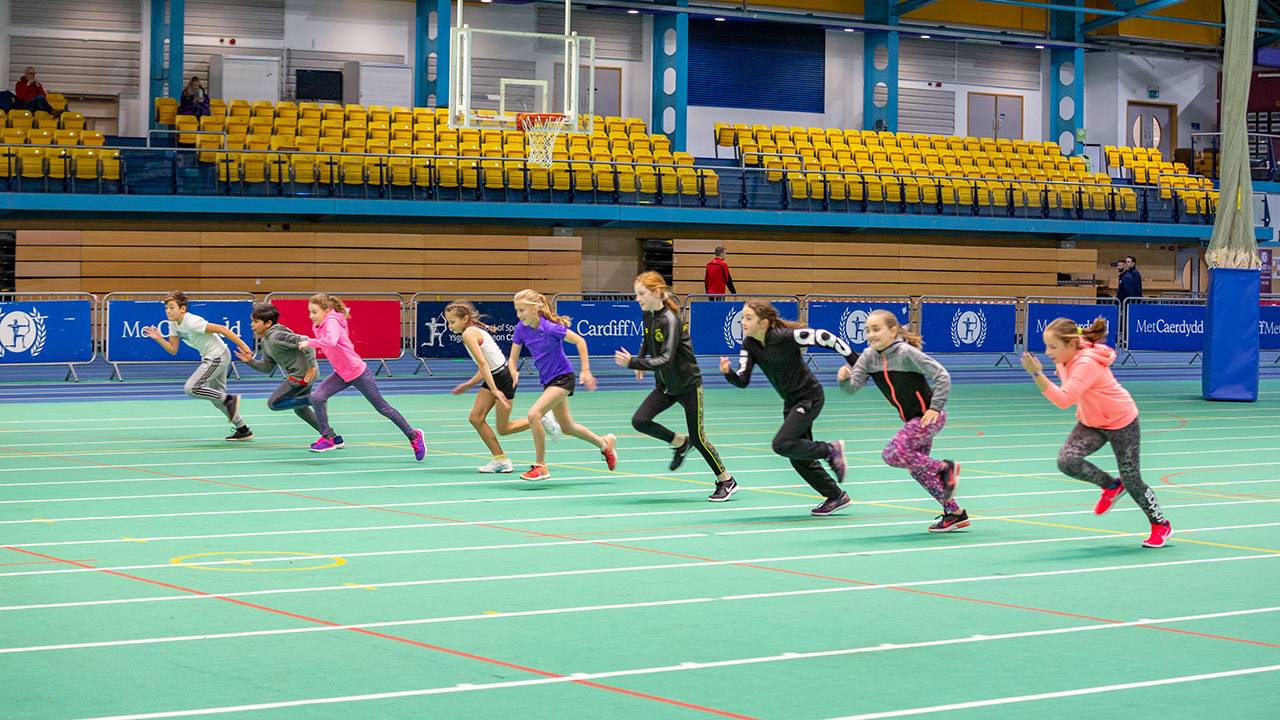 Children on indoor running track