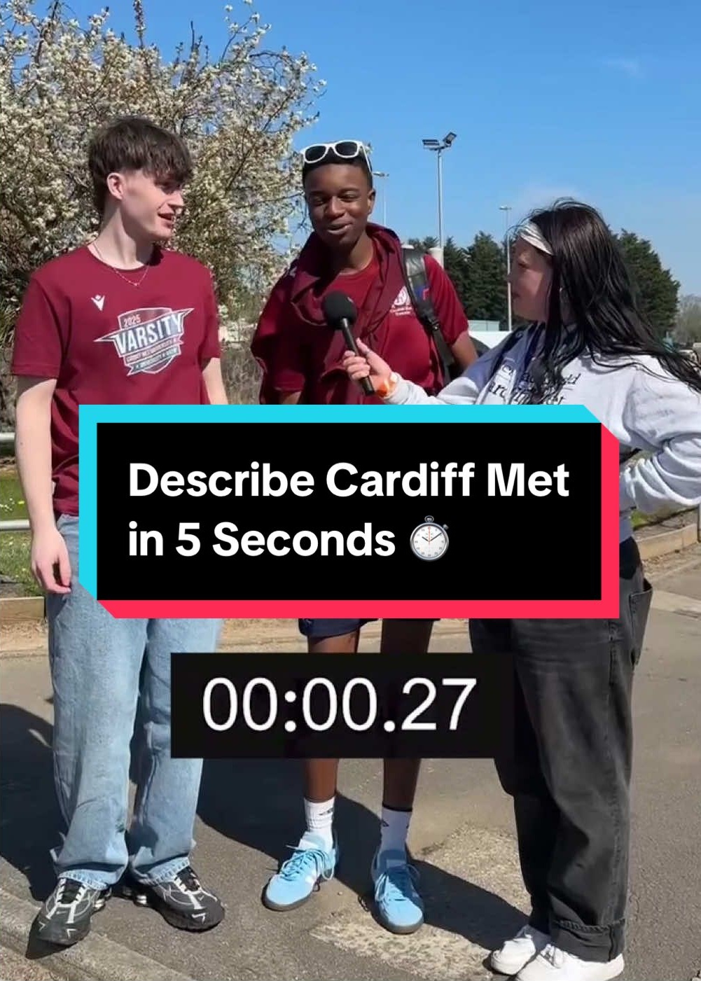 Two students being interviewed stand talking to an interviewer with the caption 