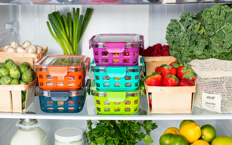 A collection of colorful food containers in the fridge